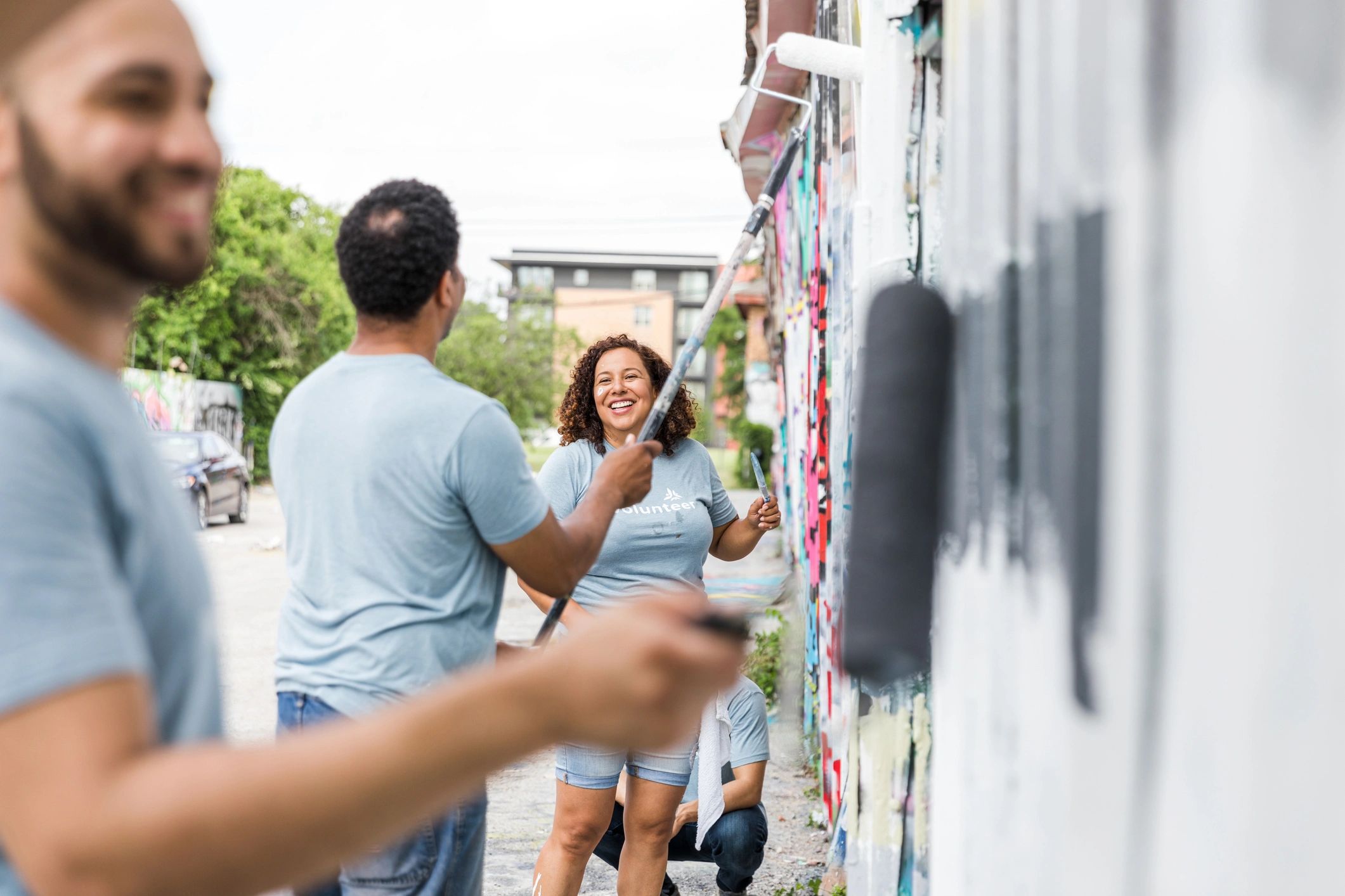Coworkers painting at the volunteer event
