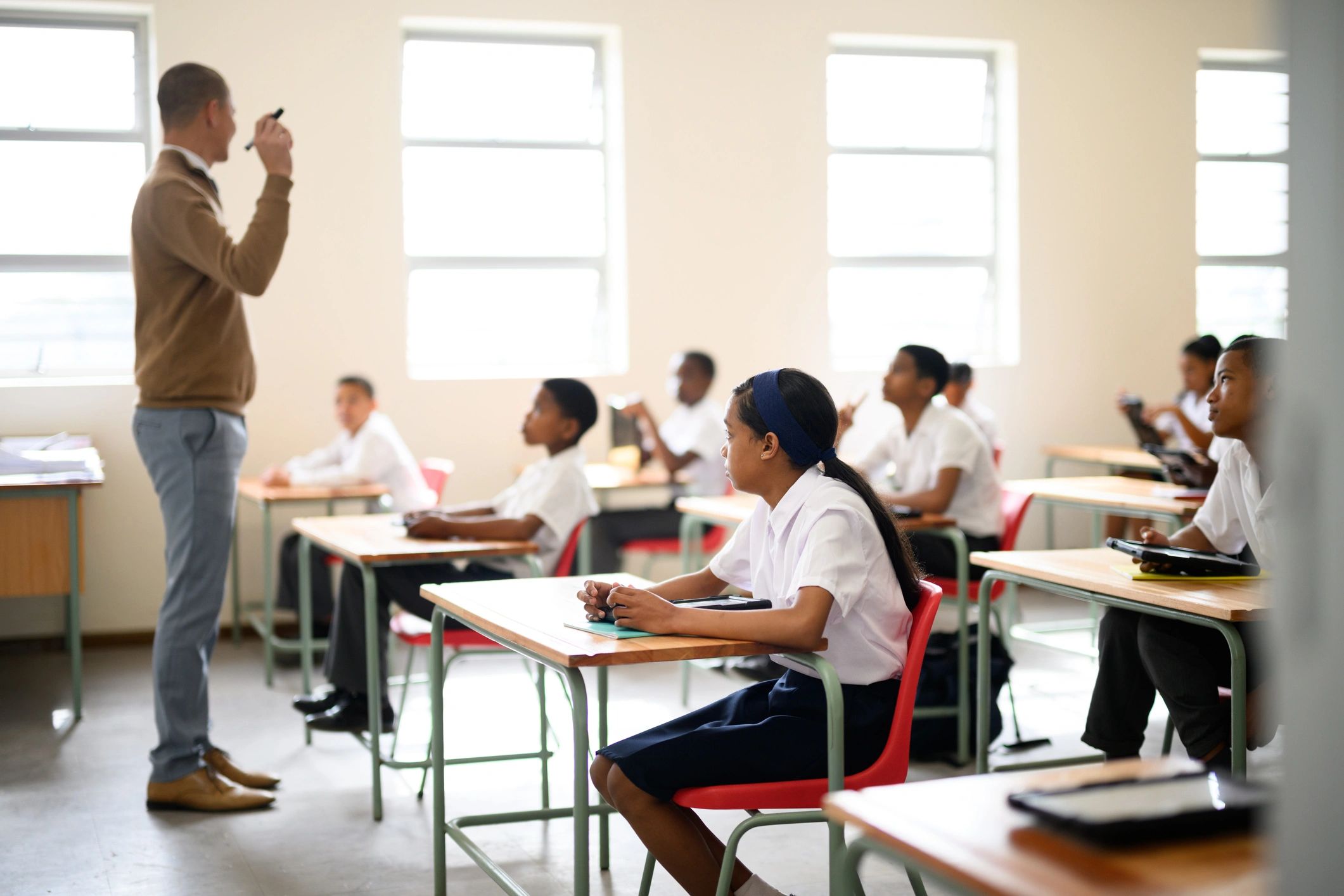 Student listening attentively in a classroom setting