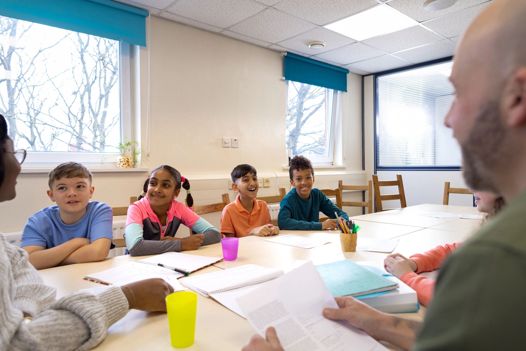 Group of children collaborating in a supportive community session