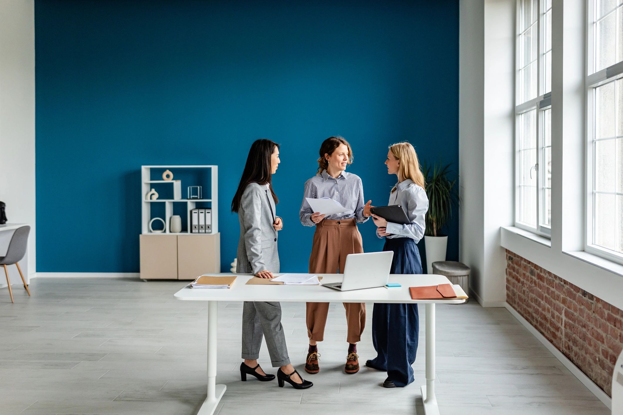 Professional team reviewing plans together
