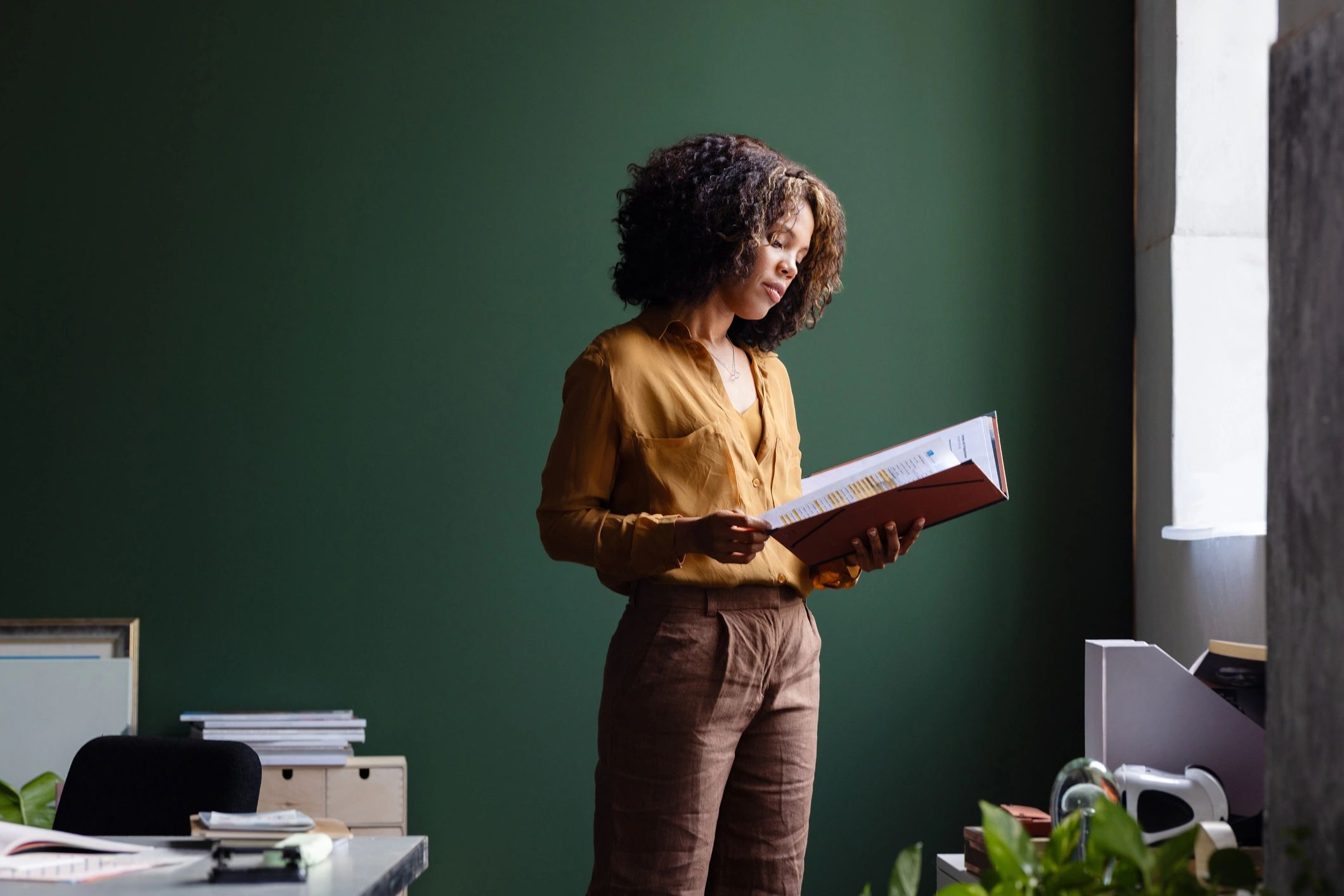 Professional reviewing documents for publication planning